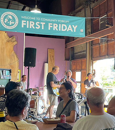 a live band playing in the reuse warehouse